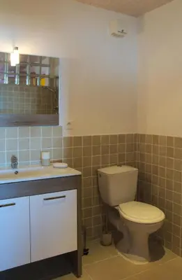a bathroom with a toilet and a sink at Que Passion in Blauvac
