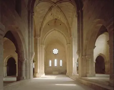 an empty hallway in a building with a window at Le petit Figuier in La Roque-dʼAnthéron