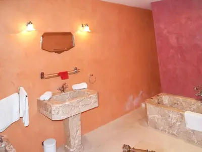 a bathroom with a sink and a tub at Villa spacieuse à Oppède avec piscine et vue imprenable in Oppède