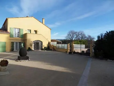 a large house with a gate and a fence at Domaine de L'Olibaou in Venelles
