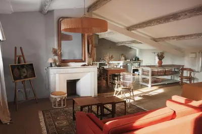 a living room with a couch and a fireplace at La Madone in Apt
