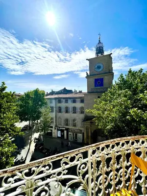 a clock tower on top of a building with a clock at Grand Hôtel De La Poste in Salon-de-Provence