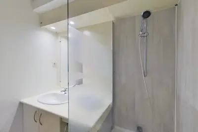 a bathroom with a shower and a sink at City Résidence Aix-en-Provence in Aix-en-Provence