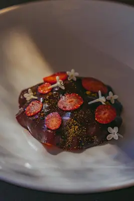 a piece of food on a white plate at Omma in Roussillon