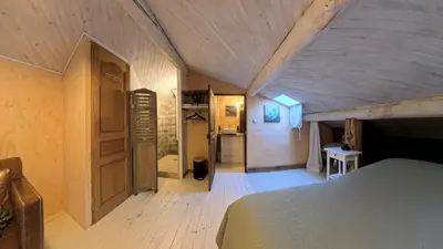 a bedroom with a bed and a room with a closet at Le 47 - Rentals in South of France in Beaumont-de-Pertuis