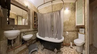 a bathroom with a tub and a sink and a toilet at Le 47 - Rentals in South of France in Beaumont-de-Pertuis