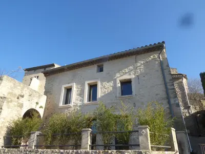 an old stone building with a blue sky in the background at The Panoramic House in Lagnes