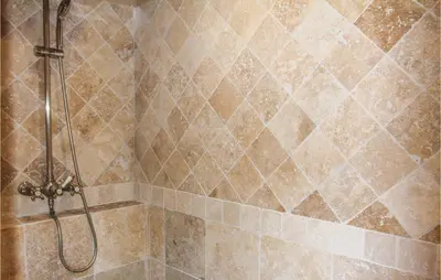 a shower in a bathroom with a tile wall at Amazing Home In Lançon De Provence in Lançon-Provence