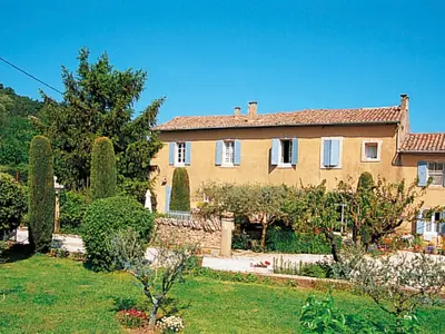 a large house with a garden in front of it at Holiday Home L'Olivier by Interhome in Ménerbes