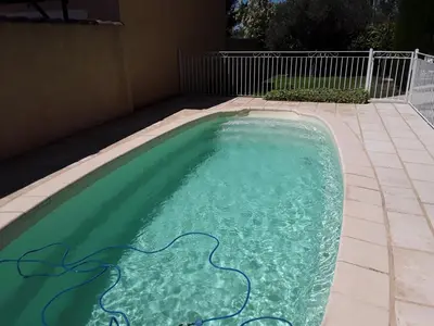 a swimming pool with a painting on it at Maison les pins in Vedène