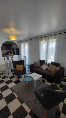 a living room with a couch and chairs and a table at Ogooué appartement entier Lumineux 94m2 in Carpentras