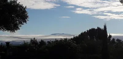 a view of a mountain in the sky with clouds at Le Bastion des Papes in Châteauneuf-de-Gadagne