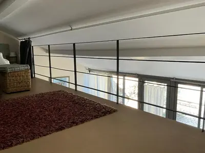a room with a large glass wall with windows at Gite Les Enfantines in Bédoin