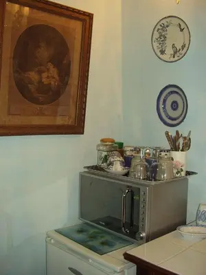 a living room with a bed and a couch at La Cordière in Lourmarin