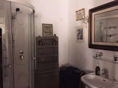 a bathroom with a shower and a sink at La Cordière in Lourmarin