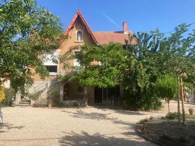 a large house with trees in front of it at Chez Zabou in Carpentras