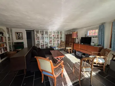 a living room with a couch and a piano at Chez Zabou in Carpentras
