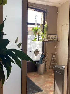 a kitchen with a potted plant and a window at L'atelier B&B in Bédoin