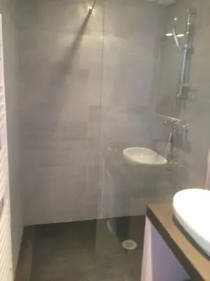 a bathroom with a glass shower and a sink at Au bon logis Luberon 50m2 in Cheval-Blanc