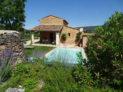 a house with a swimming pool in a garden at le bastidon in Villars