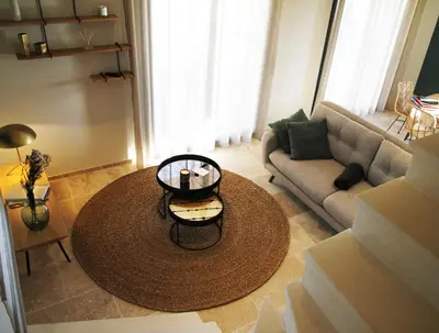 a living room with a couch and a coffee table at Les Loges En Provence 