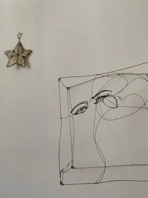 a drawing of a star hanging on a wall at Le cœur de Lourmarin Loulou en Luberon in Lourmarin