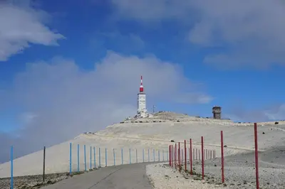 a road with a lighthouse on top of a hill at La belle histoire Gîte Ventoux in Bédoin