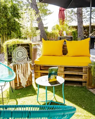 a restaurant with tables and chairs and lights at Le Safari Hotel Restaurant in Carpentras