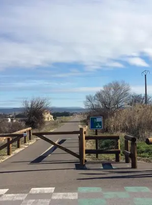 a road with a sign on the side of it at Maison Daumas Billard Français et Piscine in Robion en Luberon
