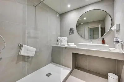 a bathroom with a sink and a mirror at Best Western Sévan Parc Hôtel in Pertuis