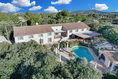 an aerial view of a home with a pool and a house at Hotel La Bastide d'Eygalières in Eygalières