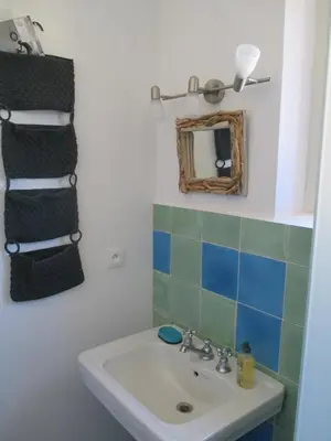 a bathroom with a sink and a mirror at Maison Itzé in Saint-Saturnin-les-Apt