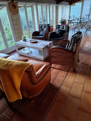 a living room with couches and a coffee table at Les Vallons Holiday Home in Lioux