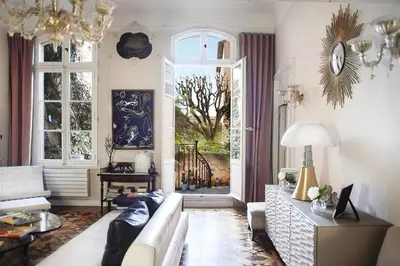 a living room with a couch and a window at Hôtel Particulier Le 28 - Spa & Art Luxury Design in Aix-en-Provence
