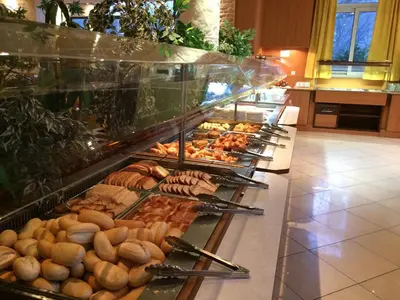a buffet line with many different types of food at Hôtellerie Notre Dame de Lumières in Goult
