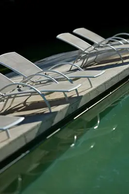 a group of boats are docked next to the water at Hôtellerie Notre Dame de Lumières in Goult