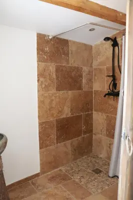 a bathroom with a sink and a mirror at L'Orgalière Alpilles in Orgon