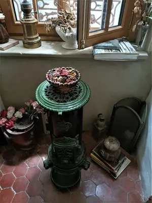 a table with a bowl on it in a room with a window at Suite Provençale in Saignon