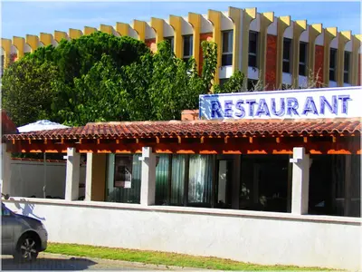 a restaurant sign on the front of a building at Aix Hotel in Aix-en-Provence