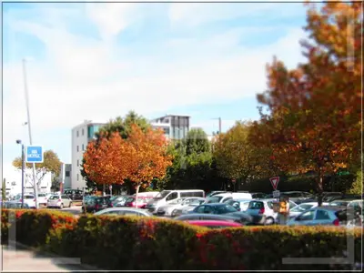 a parking lot filled with lots of parked cars at Aix Hotel in Aix-en-Provence