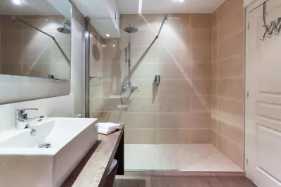 a bathroom with a sink and a shower at Les Terrasses du Luberon in Bonnieux