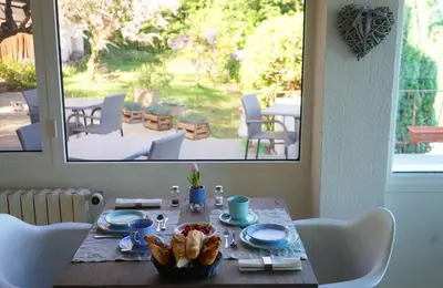 a table with a plate of food on it at Les Terrasses du Luberon in Bonnieux