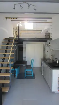 a room with a bunk bed and a table and chairs at Studio A Grans in Grans