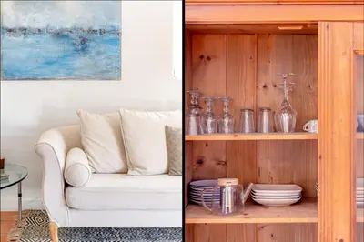 a living room with a couch and a shelf with dishes at Mas Oréa côté piscine in Gordes