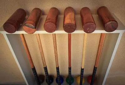 a shelf with several different kinds of baseball bats at Gite des Carmes and Spa in Le Thor