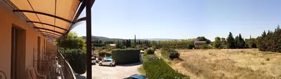a view from a balcony of a car parked on a road at Hotel Font De Lauro in Saumane-de-Vaucluse