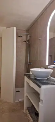 a bathroom with a sink and a mirror at Le Jas des Parpaillous in LʼIsle-sur-la-Sorgue