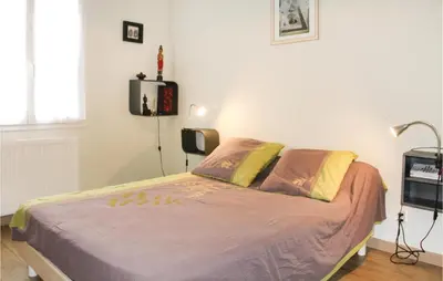 a bedroom with a bed in a room at 4 Bedroom Beautiful Home In Goult in Goult