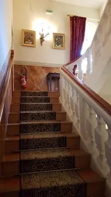 a staircase in a house with a stair case at Hotel Cardinal in Aix-en-Provence