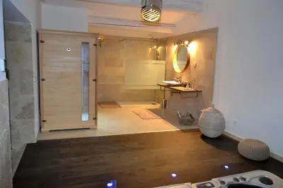 a bathroom with a shower with a sink and a mirror at L instant Magique in Beaumont-de-Pertuis